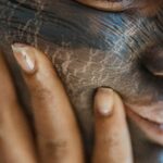 Woman with Cracks Painted on Her Face