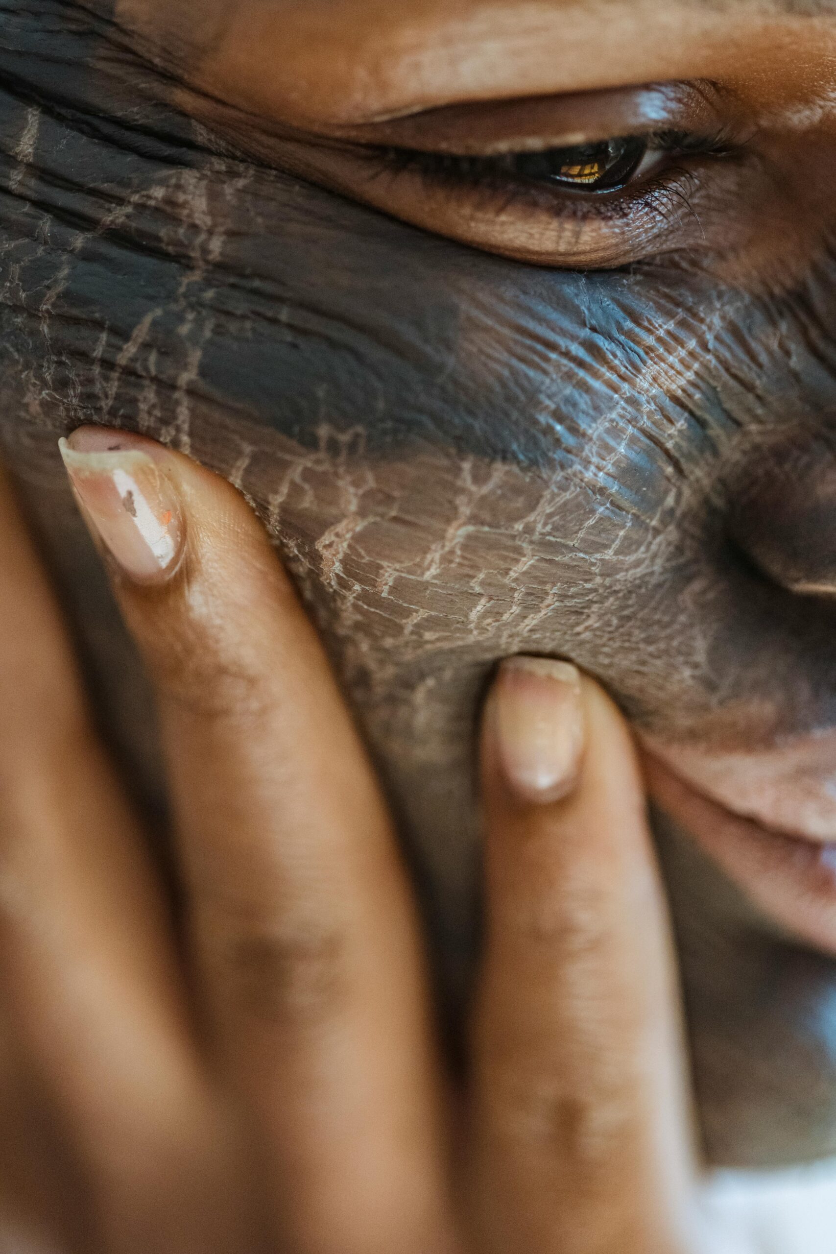 Woman with cracks painted on her face