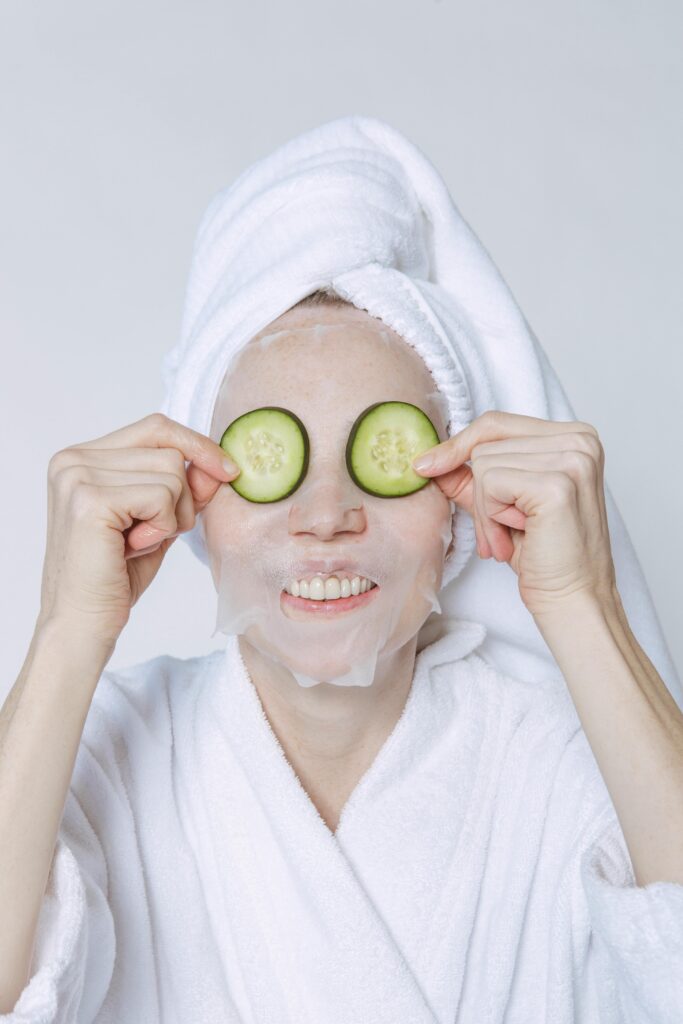 Woman Wearing a Facemask and Cucumber Slices on Her Eyes