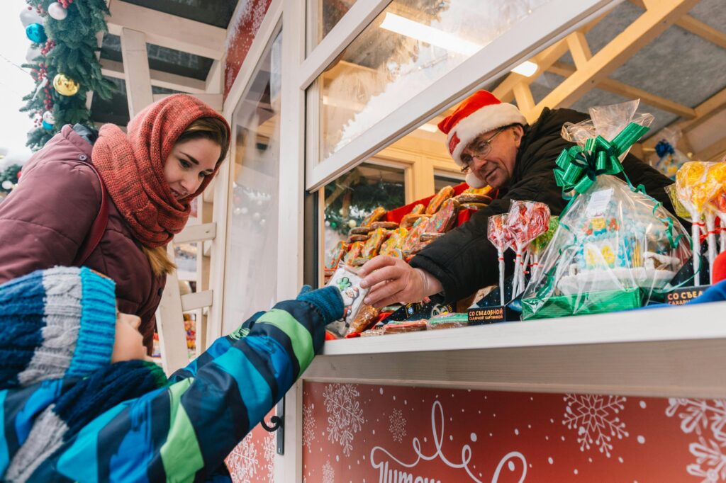 Child Buying Food from a Vendor