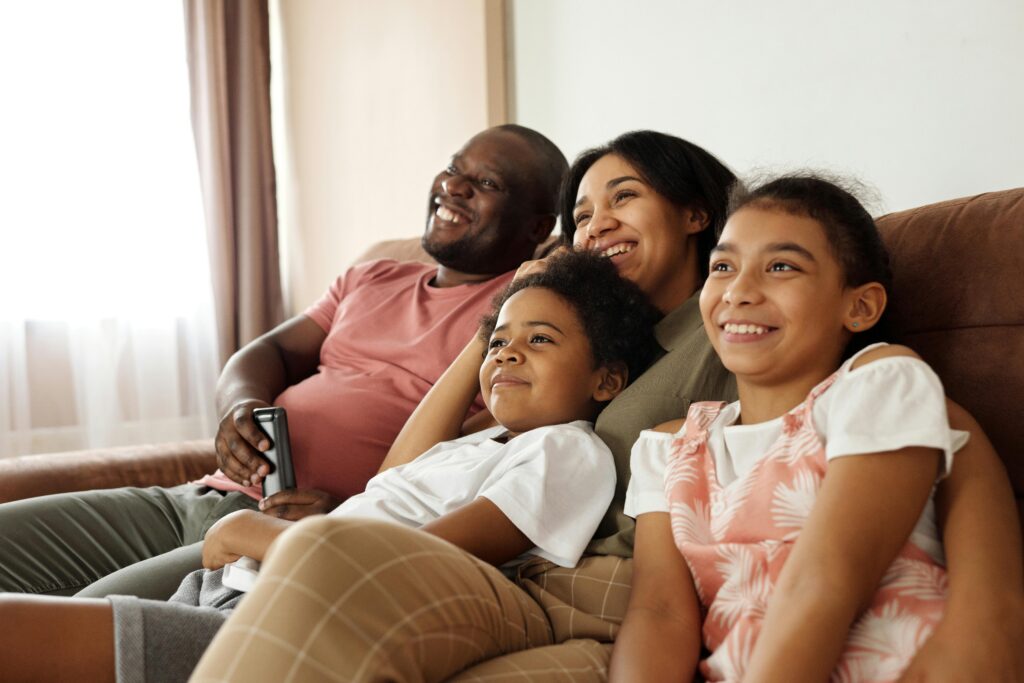 Family Watching Tv on the Couch