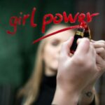 Woman Writing on a Mirror with Lipstick Girl Power