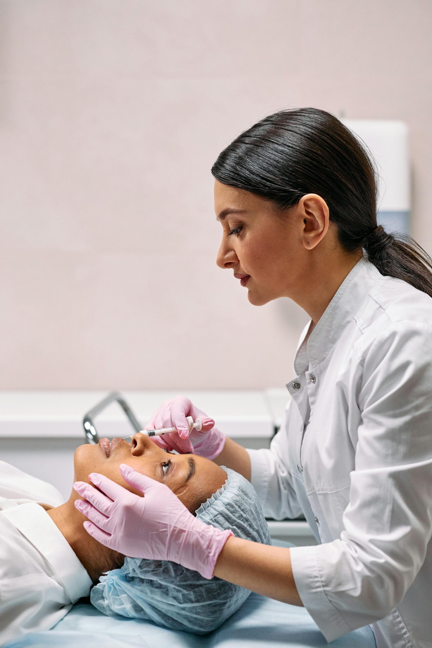 Doctor giving a woman facial injections