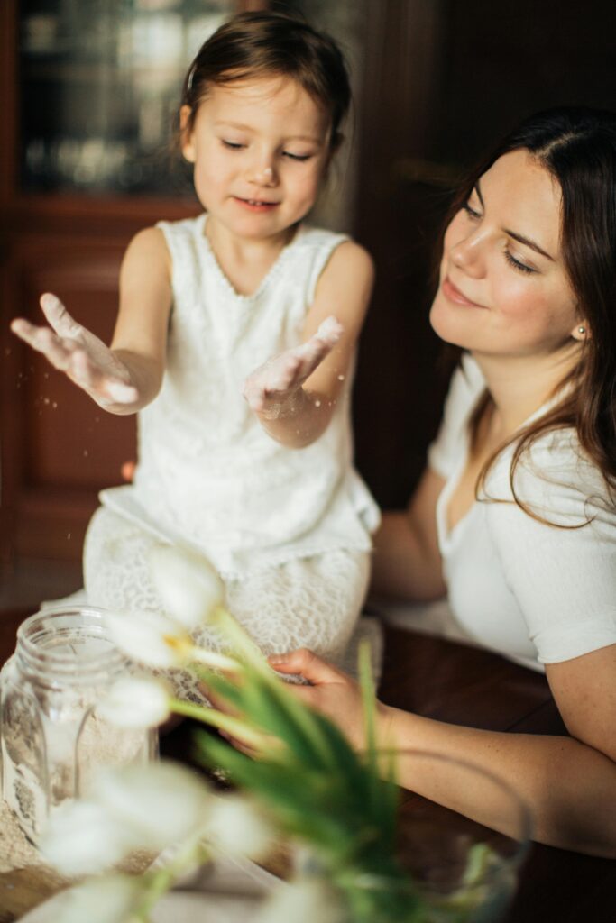 Little Girl and Woman Baking