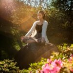 Woman Meditating in a Garden