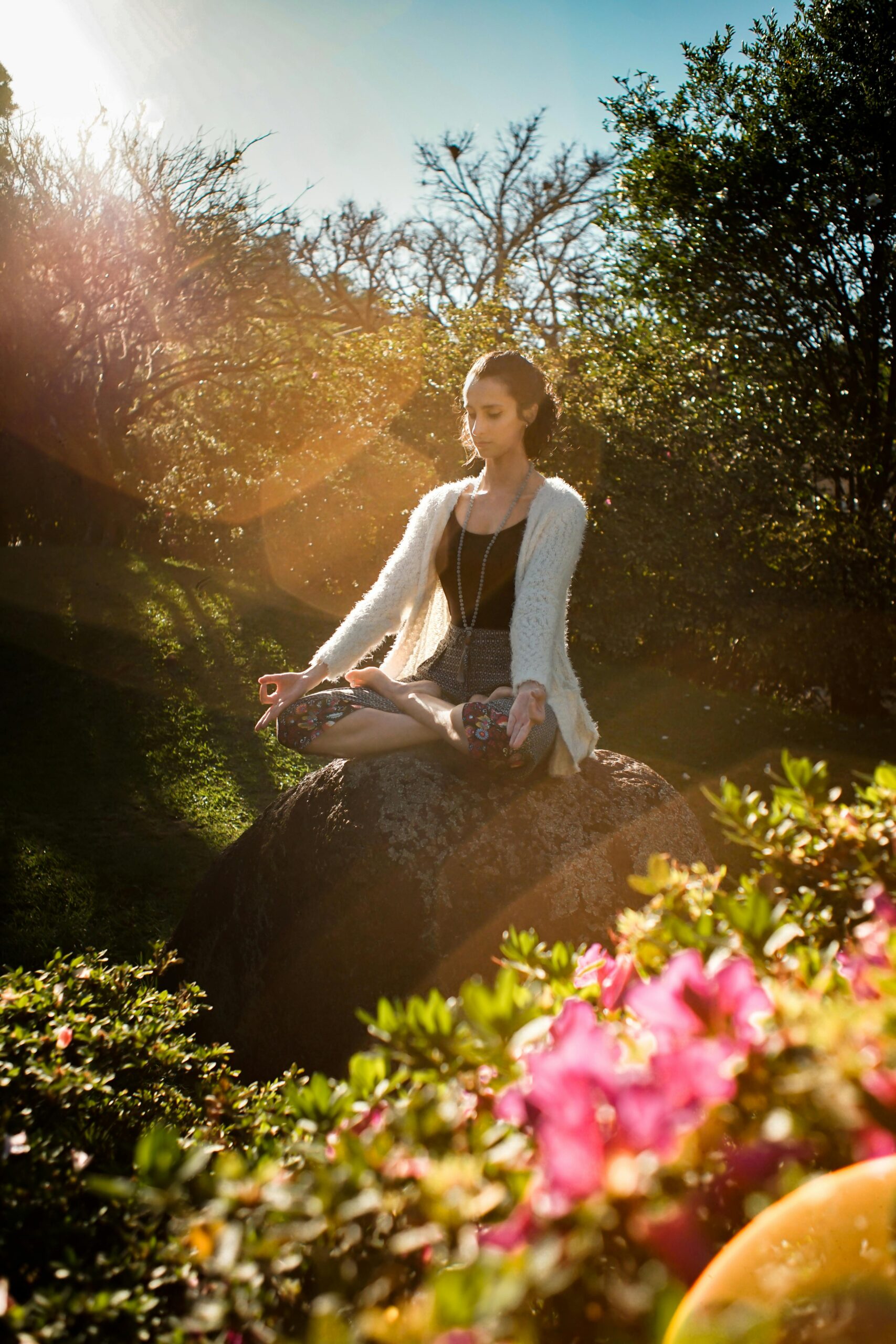 woman meditating in a garden