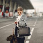 Woman Traveling with Briefcase and Looking at Watch