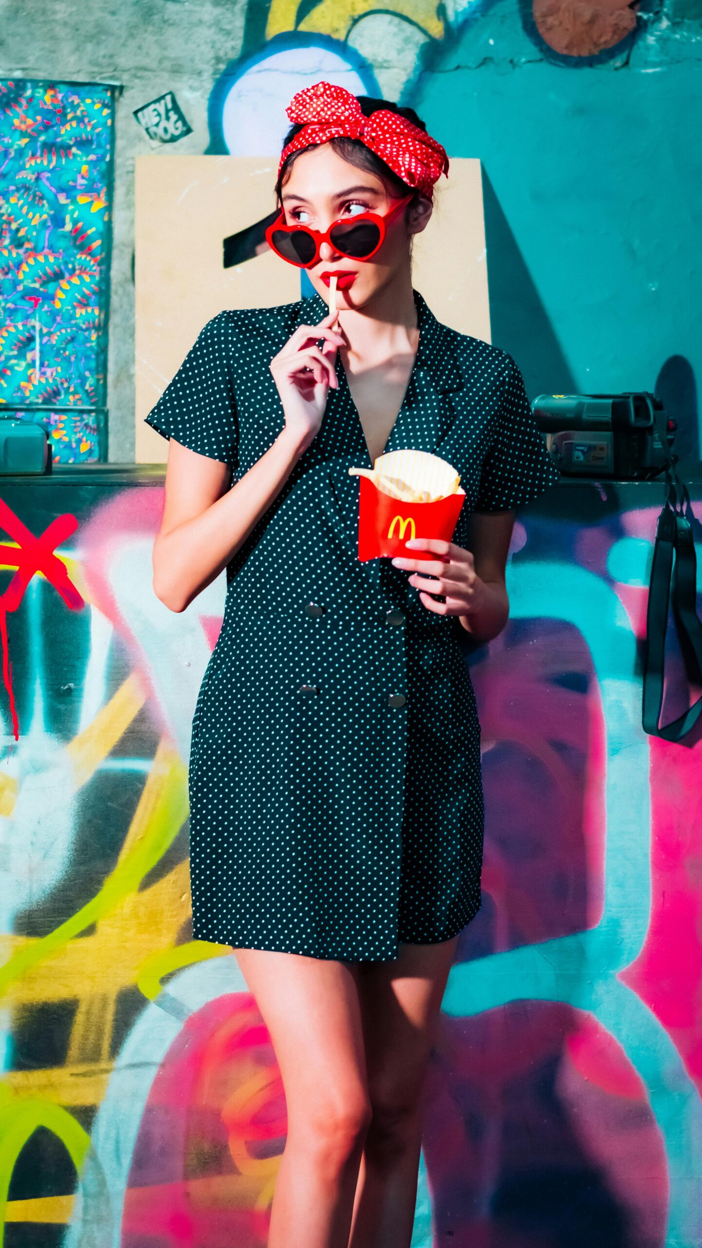 Woman standing eating french fries