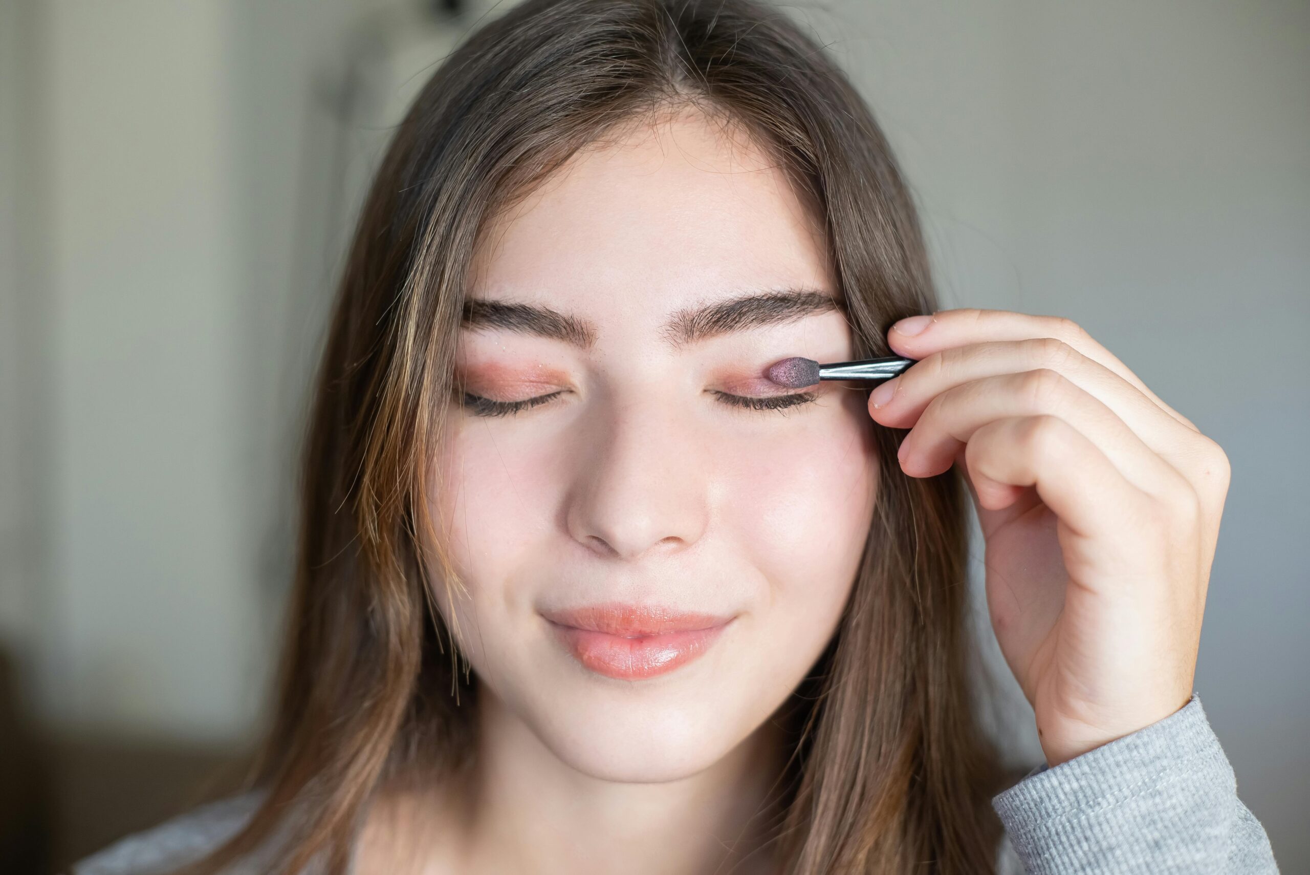 Woman applying eyeshadow