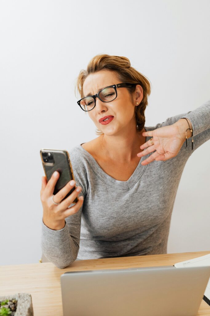 Woman Looking at Her Cell Phone