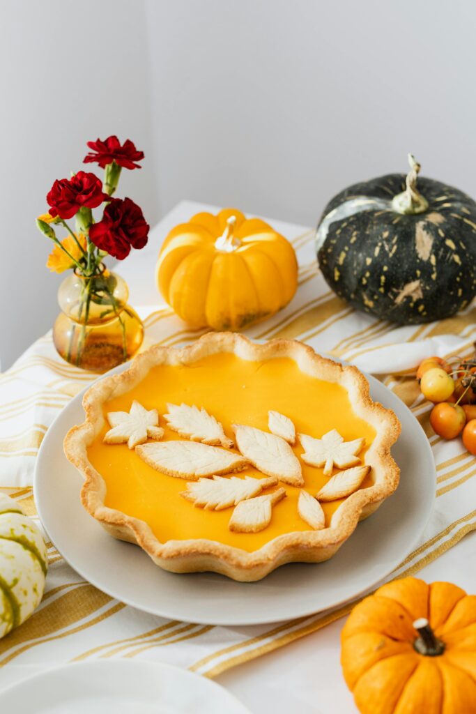 Decorative Crust Pumpkin Pie with Gourd and Pumpkins