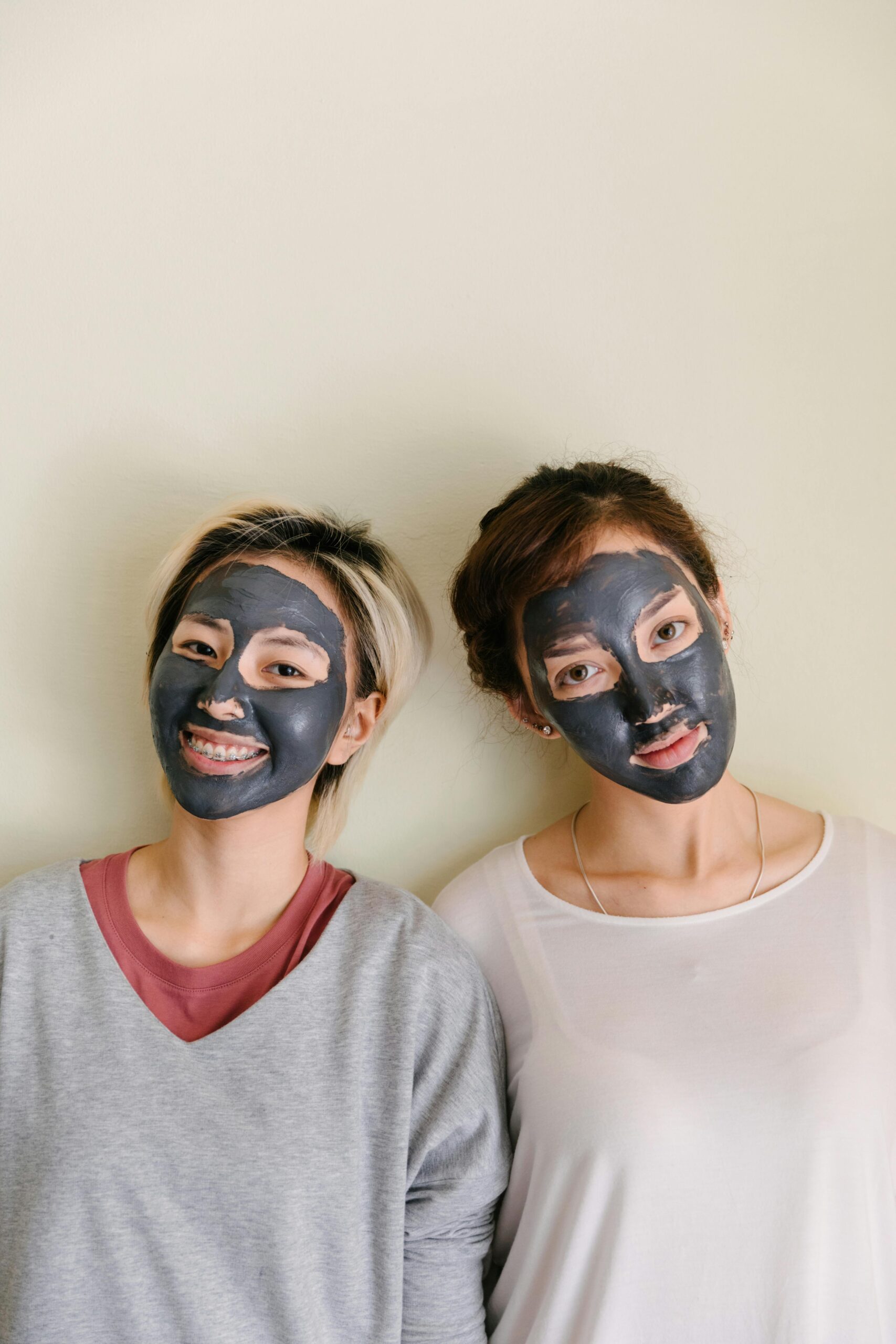 two women wearing skincare facial masks