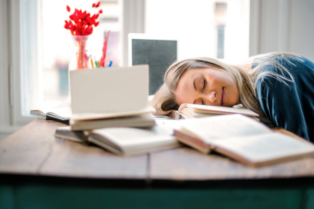 Woman Sleeping on Books