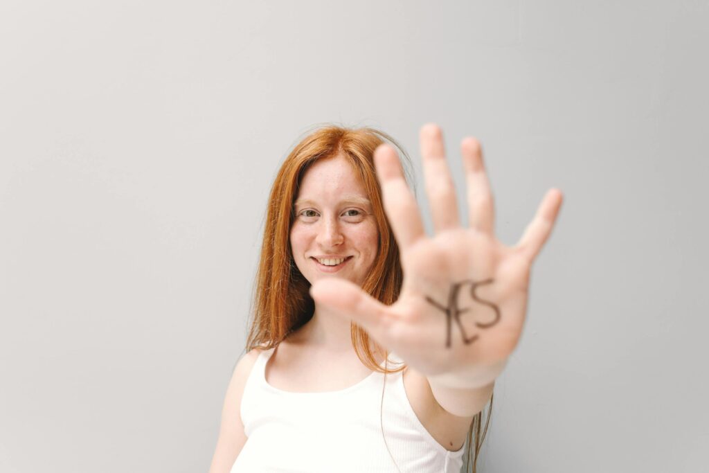 Woman with Yes Written in the Palm of Her Hand