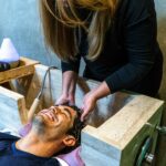 Woman Washing a Mans Hair