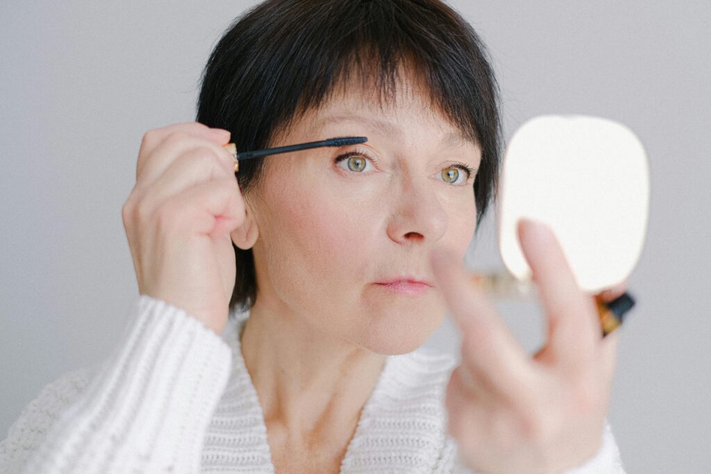 Woman Putting on Mascara