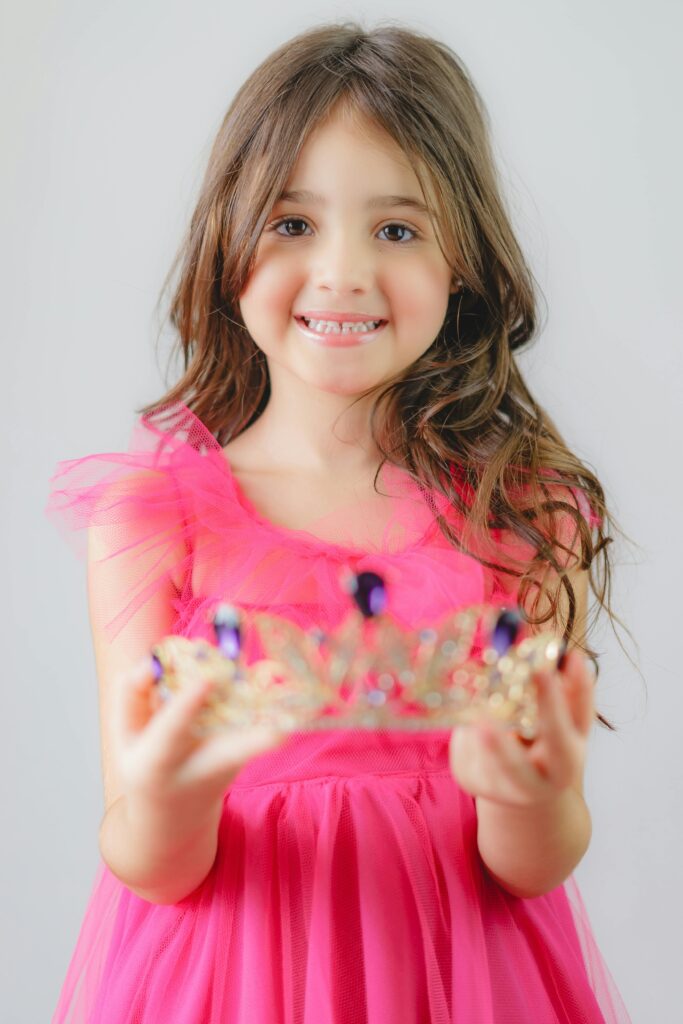 Little Girl Holding a Crown