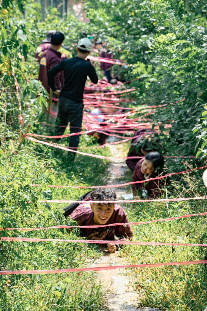 Boys Crawling Through an Outside Maze