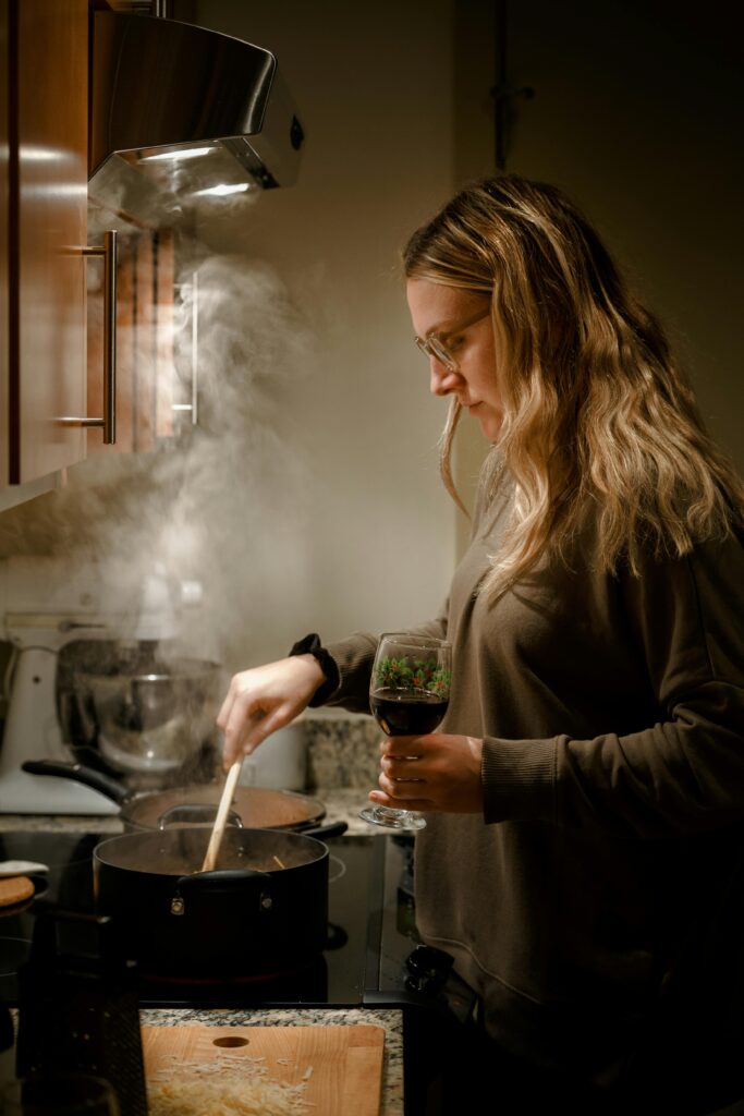 Woman Cooking on a Stove