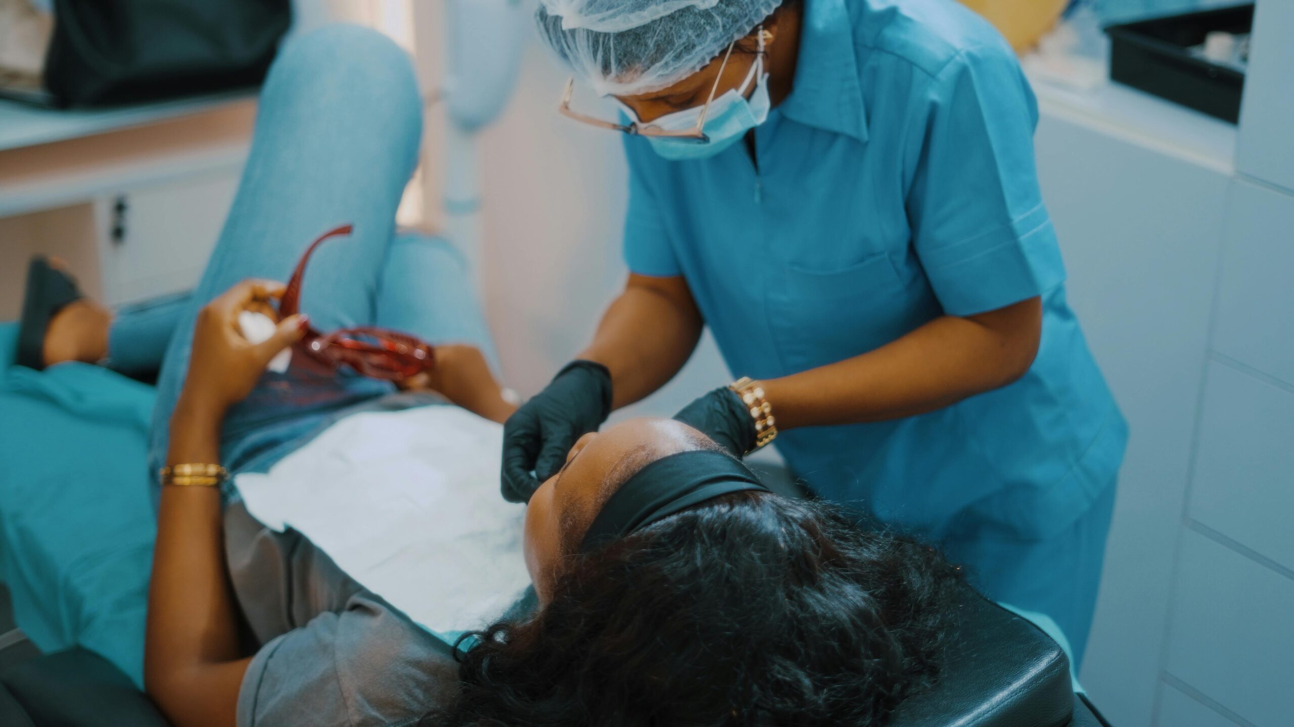 Woman receiving dental treatment in a dental chair