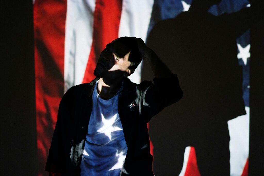 Person in Shadow of American Flag Projection