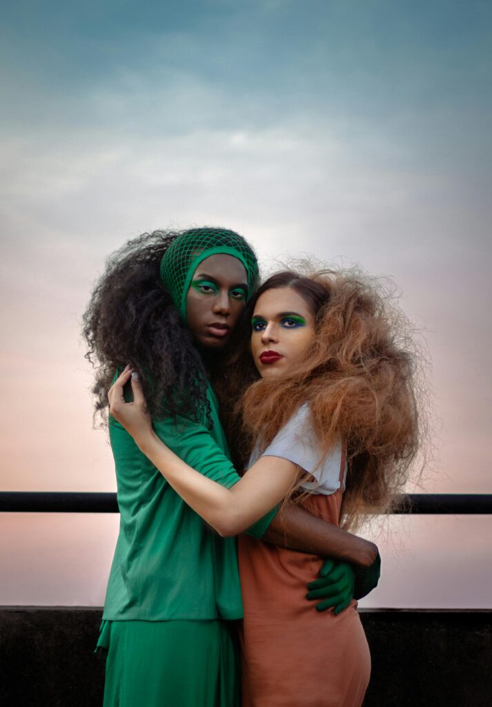 Women with Big Hair Hugging Each Other