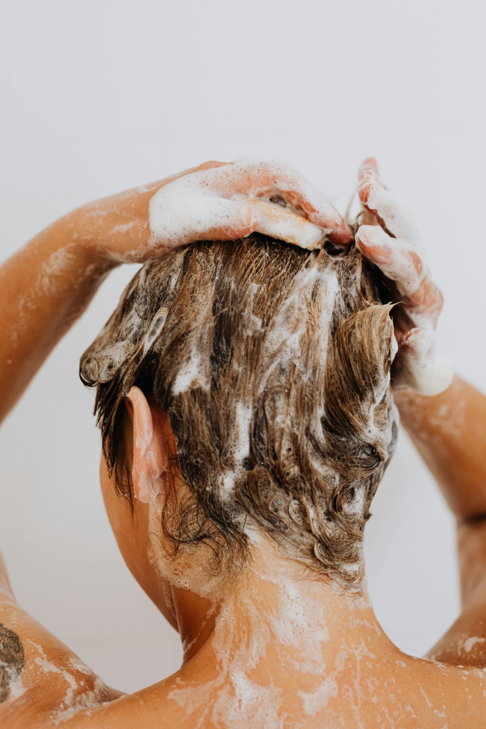 Woman Washing Her Hair Photo Courtesy of Photo Courtesy of Kaboompicscom