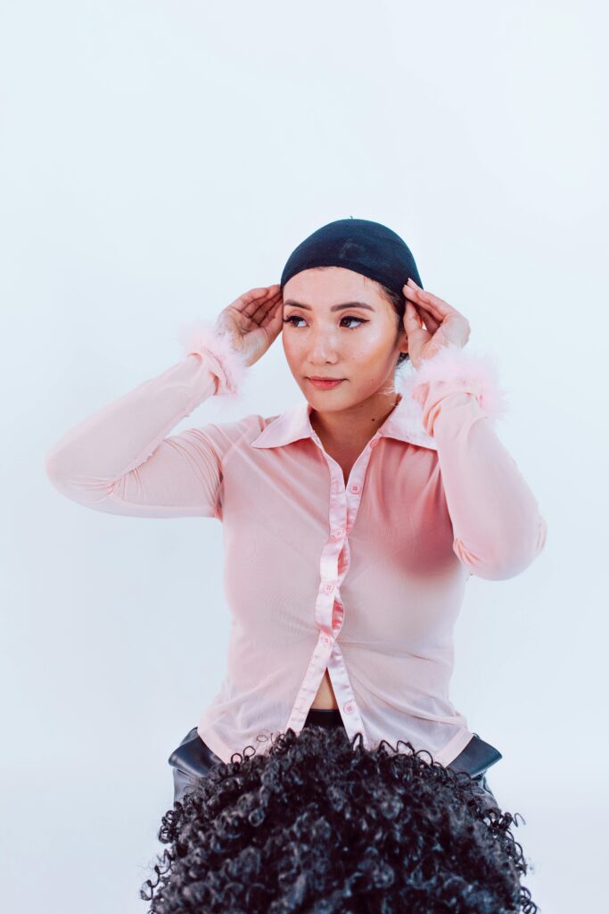 Halloween Hair Styling Woman Putting on a Wig Cap