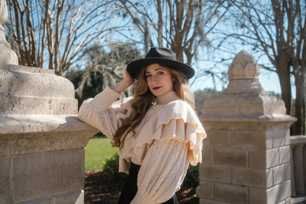 Woman Wearing a Sweater and a Hat