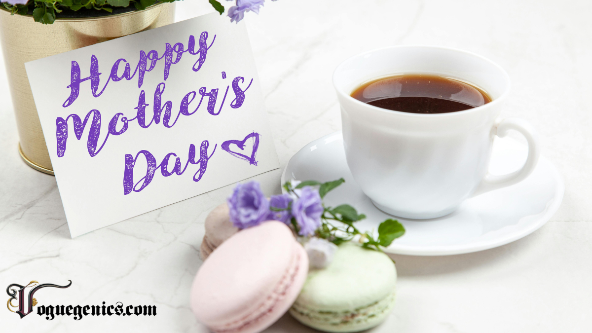 a White Teacup Filled with Coffee Sits Beside a Small Bouquet of Purple Flowers Pastel Macarons and a Card That Reads happy Mothers Day in Purple Script